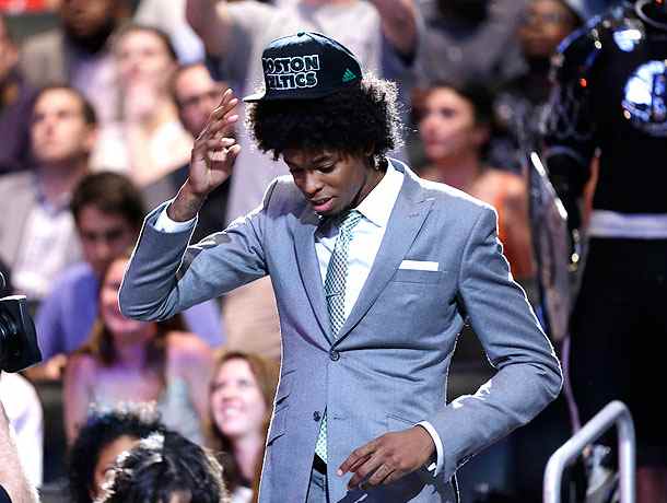 Lucas Nogueira's hair won its battle with his Celtics cap in emphatic fashion.